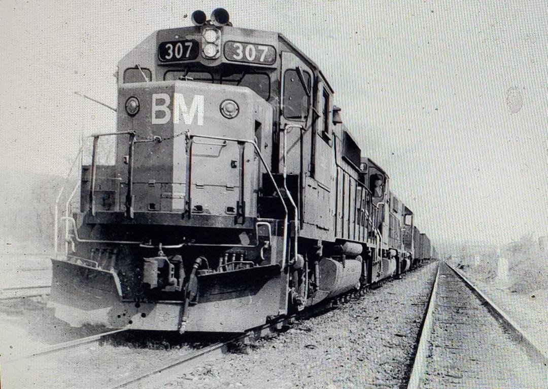 Train LA-ME (Lawrence MA to Mechanicville NY) with three GP-40-2s, 124 cars, Mechanicville NY. May 1983. D F Kydd Engineer