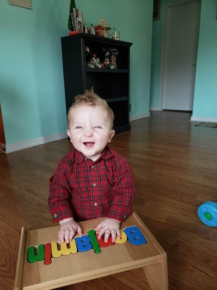 M
Benjamin Rathjen enjoying his first Christmas .