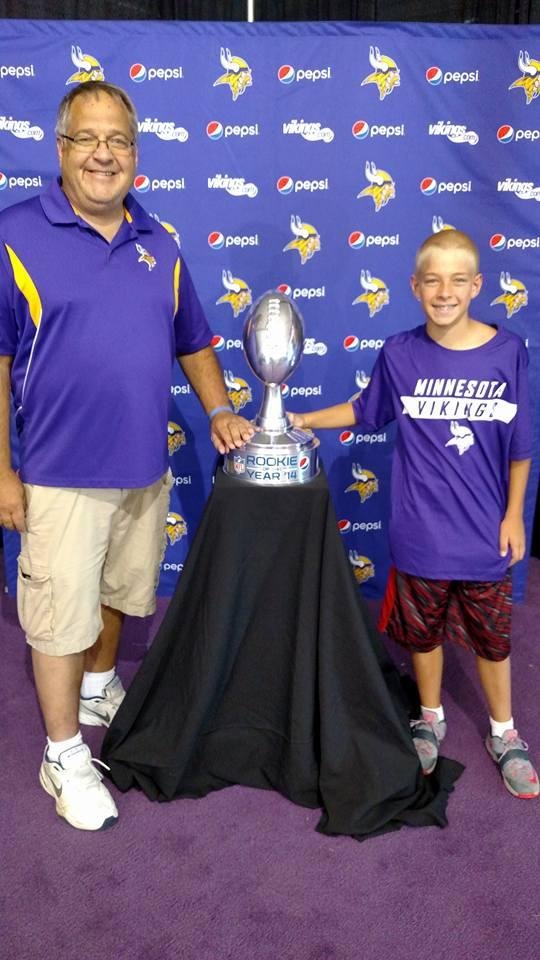 Posing with the Rookie of the Year trophy