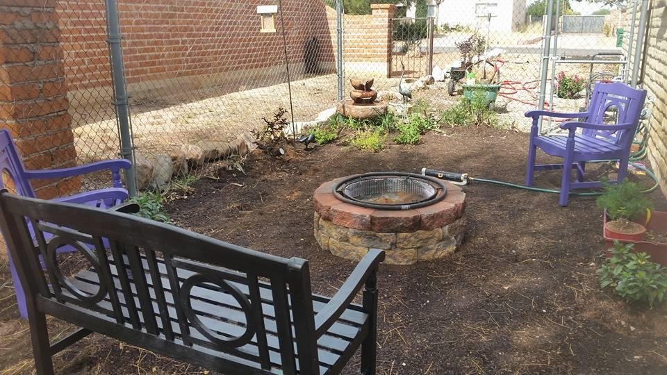 The fountain in the corner and the firepit was my Anniversary present. Then I planted liriopie, different colored Lantana, succulents around the fence line, two orange trumpet vines, a fuscia colored Crep Myrtle, and two ga