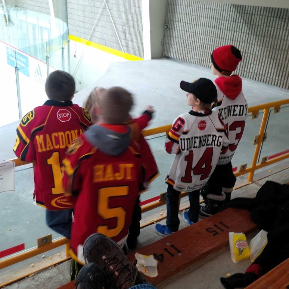 Son number 3 at a hockey game with his Buddies! Dad is with the Dads at the bar!