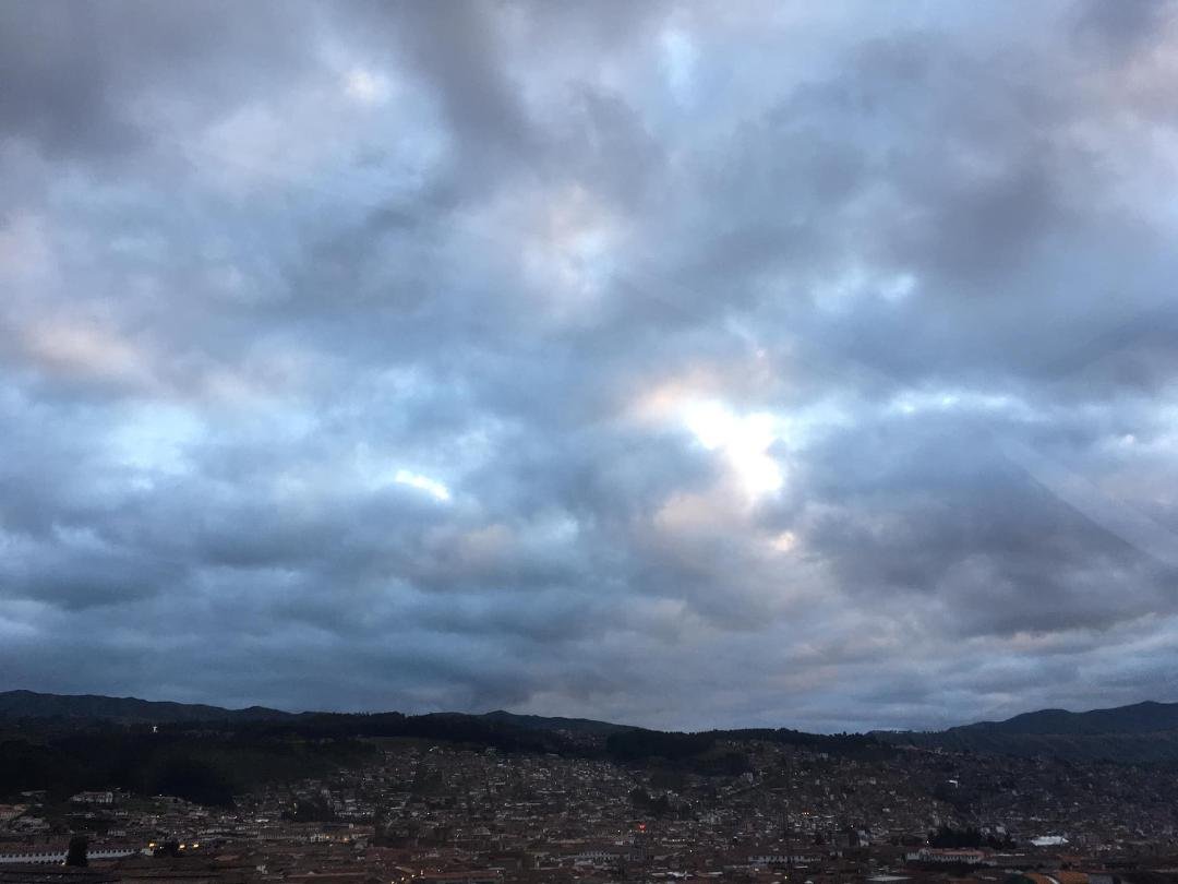 Spent a night in Cusco with my friend Aly from Florida. We got up early to have a sunrise breakfast on the hotel roof terrace where I saw this cherib with a halo in the clouds watching over this beautiful city. (She's a sm