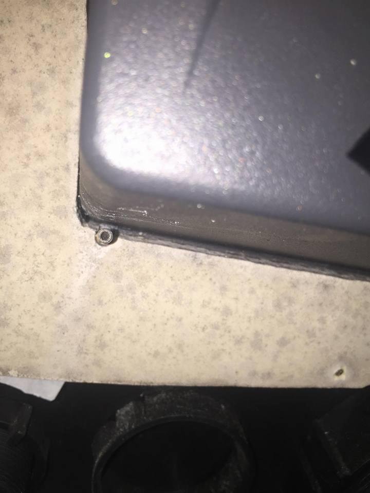 Does anyone know what type of fastener this is and what type of tool do I need to remove it is holding my chartplotter flush mounted into my center console