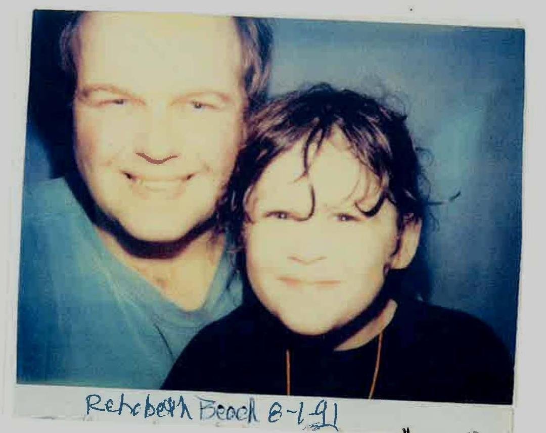 Jeff and Laura at a photobooth on boardwalk of Rehobeth Beach, 8-1-91