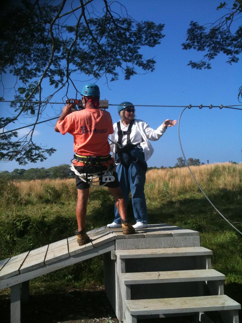 "Tiny" and me on a launch platform -- he's hooking me up to the zipline for a ride down the hill.