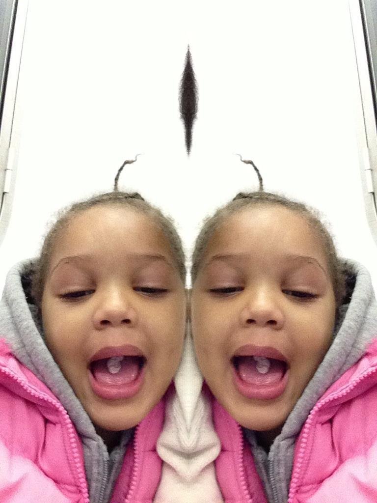 Omarea playing with uncles IPad mini and I think I have a lil photographer in my care.