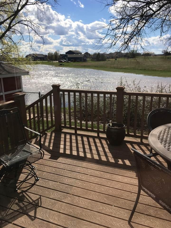 Looks like lakefront property, but it's actually the flood ditch by my back yard.  A beautiful sunny day for a change after all that rain (which we needed).