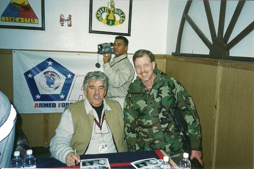Dennis Farina, RIP, on a visit to Bosnia 2002. Ike Hendricks in the background filming for MWR.