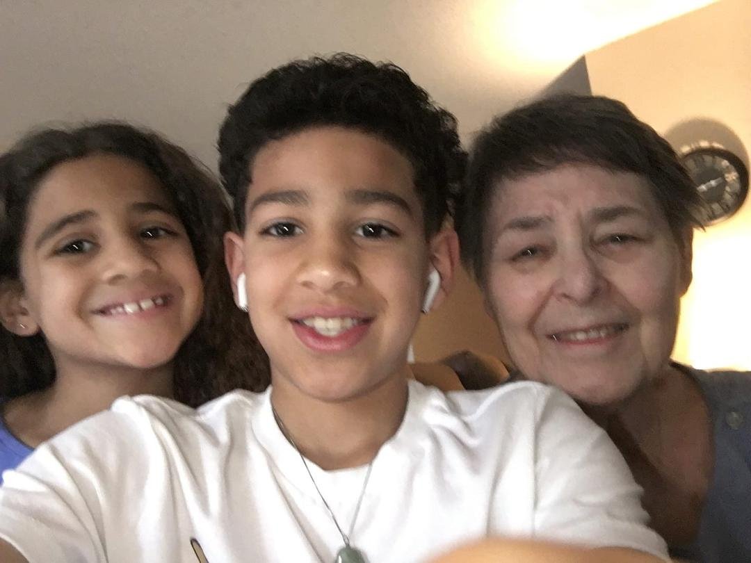 Grandma has company and is very happy