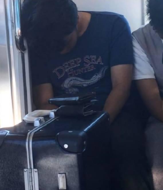 only in japan...man sleeping on a train who has left out his phone and wallet..no problem...