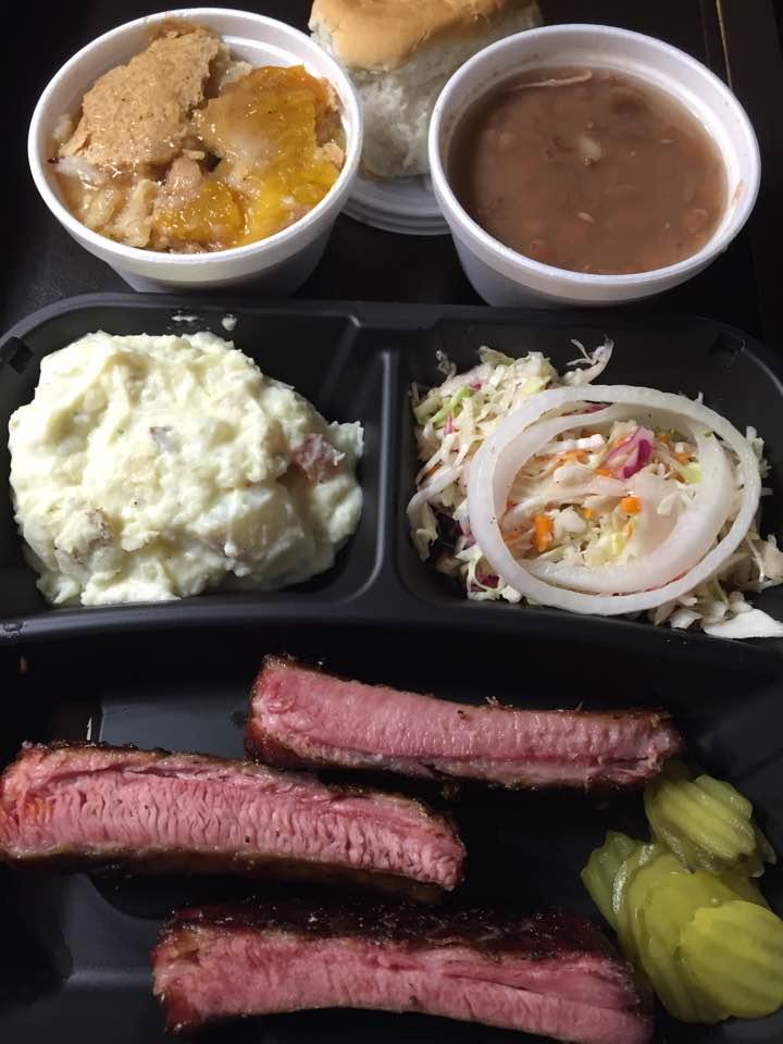 Dinner for tonight from Bill Miller BarBQ:
Pork ribs, potato salad, Cole slaw, pinto beans, roll, and Peach Cobbler!!! Yum!