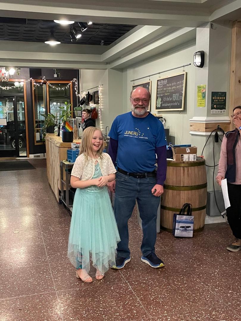 Ecstatic and energetic 9-year-old Maddie Sullivan, first place overall for the women, with her aging, increasingly decrepit grandfather, who somehow won for the men. Even JTRR President Kym (at right) is snickering at the t
