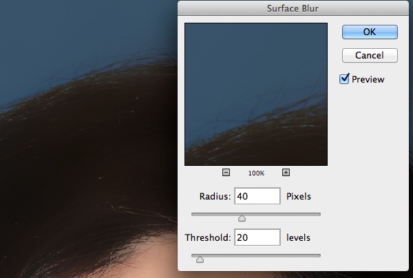Adjust Radius and Threshold controls for the Surface Blur tool