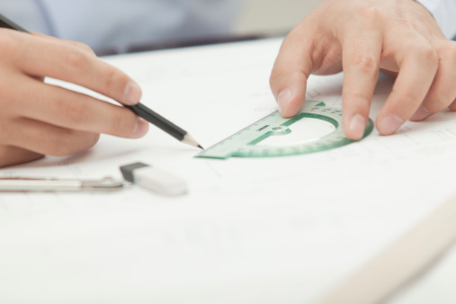 Architet with a protractor and pencil.