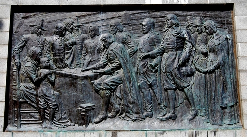 A bas-relief panel on the base of the Pilgrim Monument depicts the Pilgrims signing the Mayflower Compact in 1620.