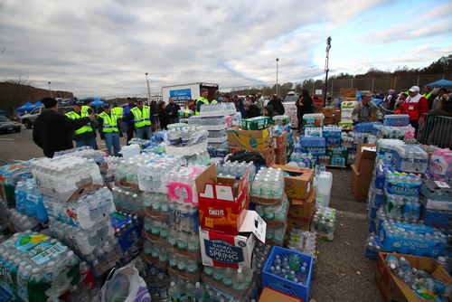 Volunteers & national guard assembled at New Dorp High School to render aid to people recovering from Hurricane Sandy.