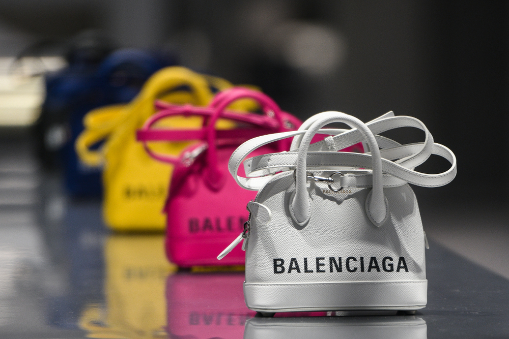 Balenciaga luxury purses in a store.