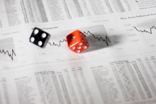 Dice rolling over stock reports.