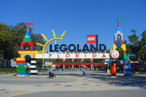 HOUSTON, USA - JANUARY 12, 2017: Legoland sign in the main entrance to Legoland with some people in the enter. Legoland is a theme park based on the popular LEGO brand of building toys.