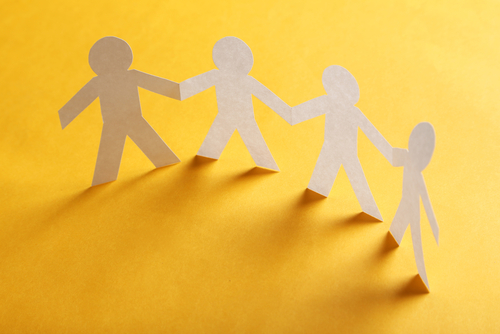 Paper people on the orange paper background