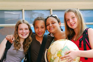Girls holding globe