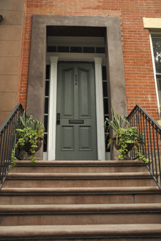 front door of a brick home