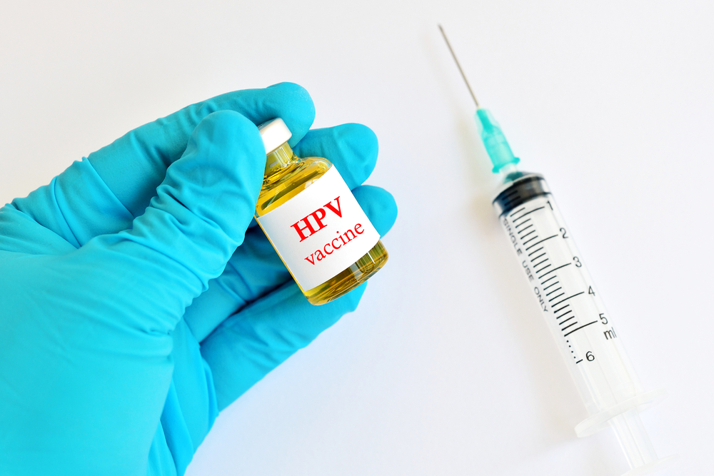 Needle and HPV vaccine bottle