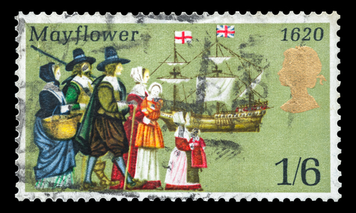 CIRCA 1970: Commemorative mail stamp printed in the UK featuring the sailing to America in 1620 of the Pilgrims from Britain onboard the Mayflower ship