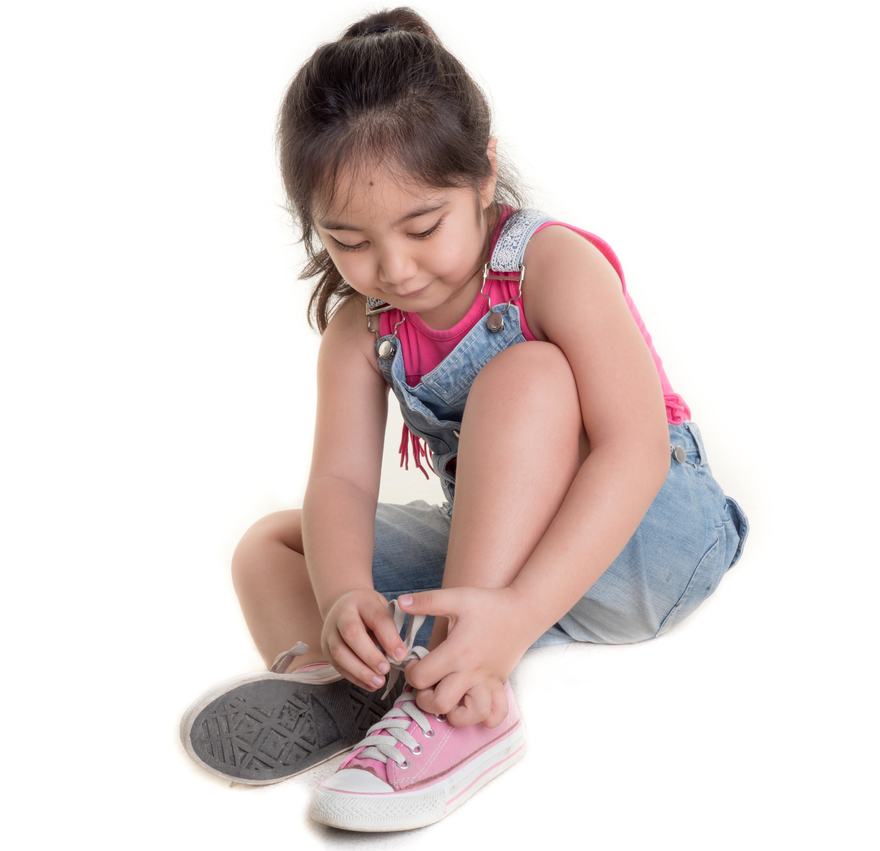 Girl tying her shoe