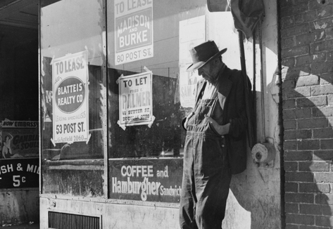 Lone man in farmer's overalls, San Francisco's Skid Row at Howard Street.