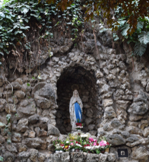 Holy Mary statue in a chapel with the appearance of a grotto.