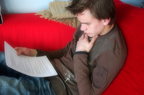 student reading over paper