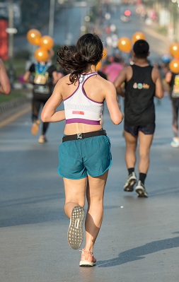 a woman running a race