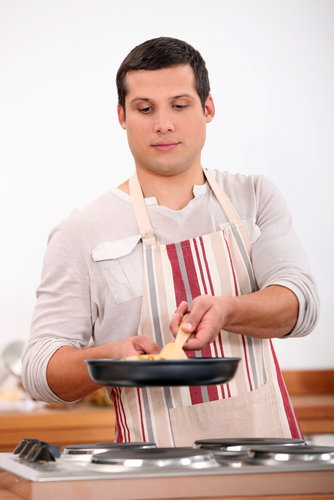 young man cooking.