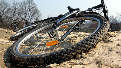 a mountain bike lying on its side on the ground