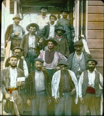 An early era color photograph showing Spanish laborers working on the Panama Canal