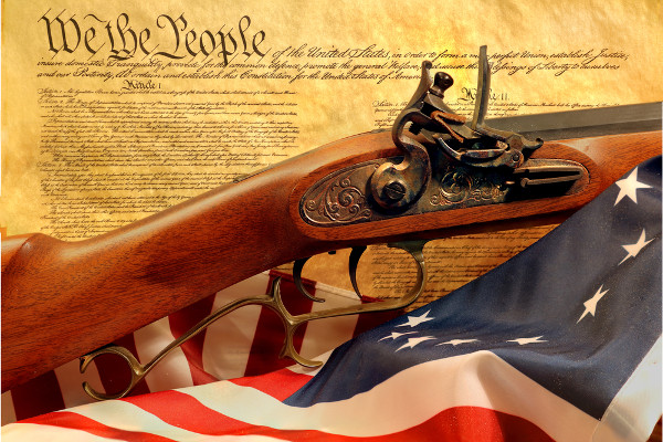 a gun, American flag, and The Declaration of Independence