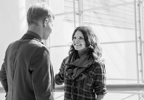 A girl and a guy in a converstion.