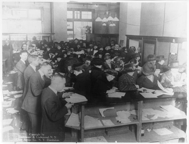 citizens complete tax returns in an Internal Revenue Service office in 1920