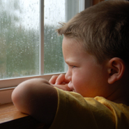 kid looking outside of window