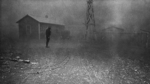 Farmer stands in a dust storm in New Mexico, Spring 1935.