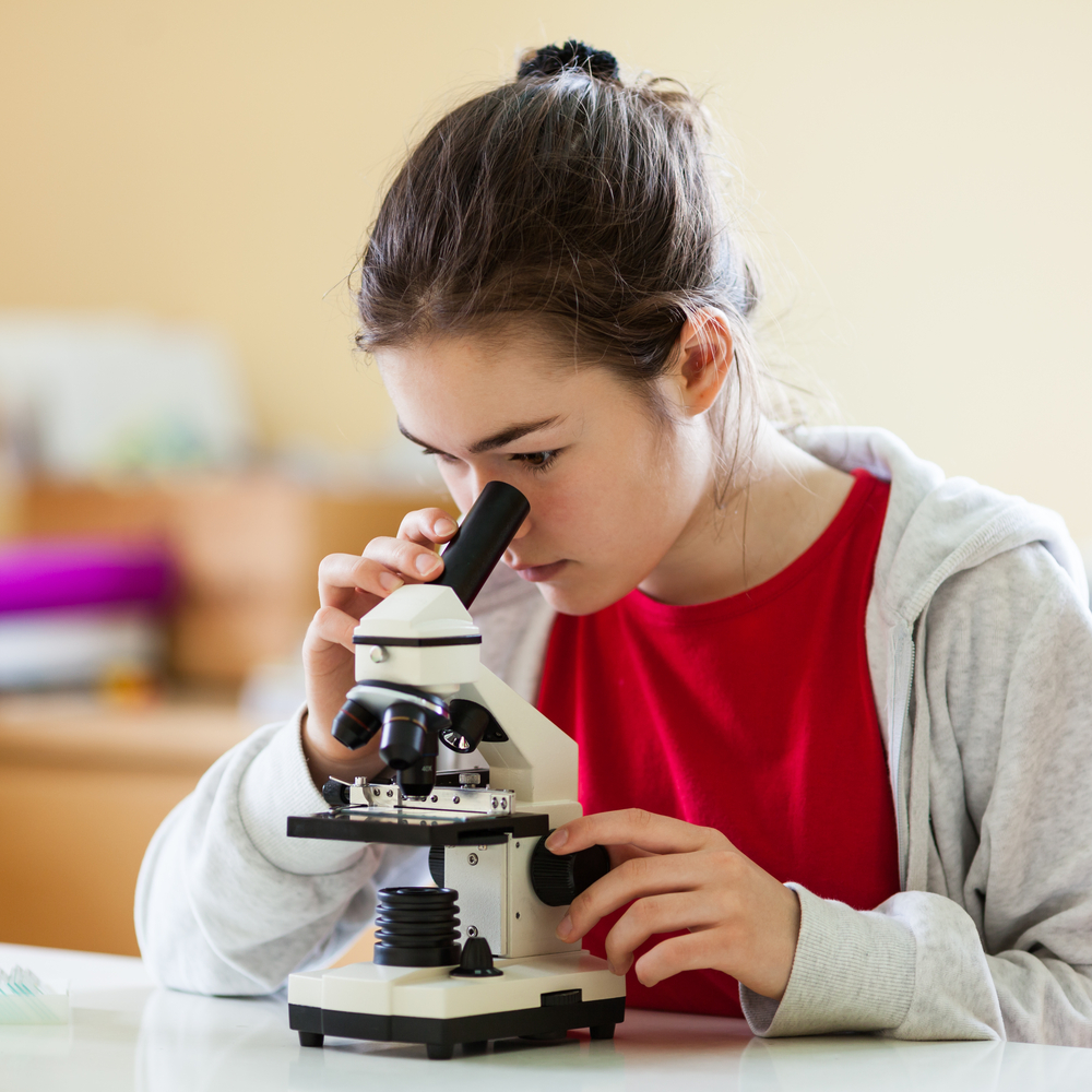Student using a microscope