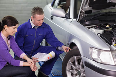 mechanic touching wheel