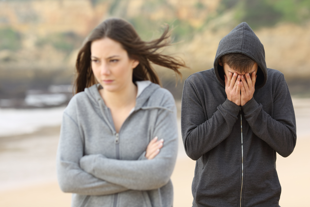 Upset couple walking together