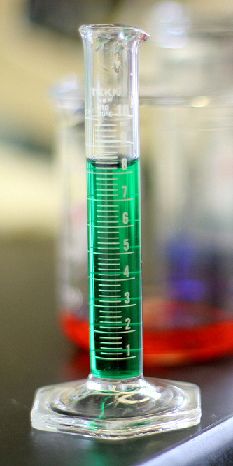 Liquid B in a graduated cylinder contains liquid a little above 8 liters