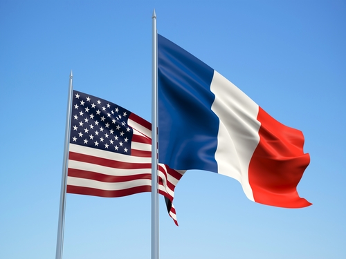 American and French flags waving in the wind.