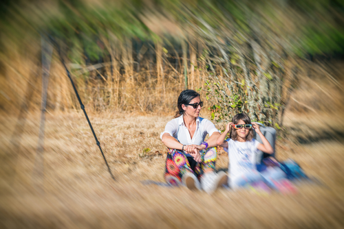 Mother and daughter watching solar eclipse.