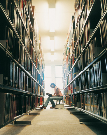 student reading in library