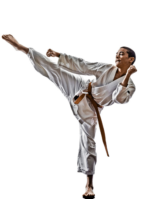 young man doing a karate kick