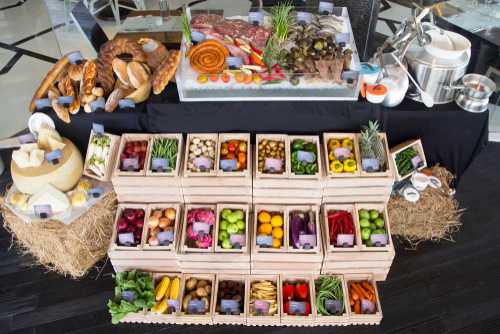 Display of different food at the farmers market or buffet, variety of fruit, vegetables, chees, bread, meat and seafood